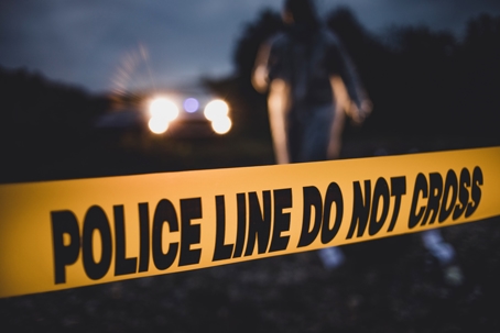 Police units react on the spot. A horrible crime near the river. Police line Do not cross